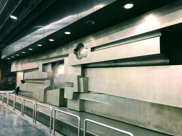 The RER A station under the Esplanade de la Defénse is brutal, the art? more brutal