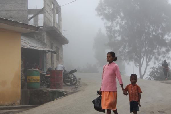 I feel it like another Universe. We climbed up the hills to Maubisse. It was market day. I remember driving, but my wife ready with the "eye of the beholder". Three generations in one frame.